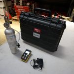 The items within the Confined Space Gas Detector kit laid out on a table